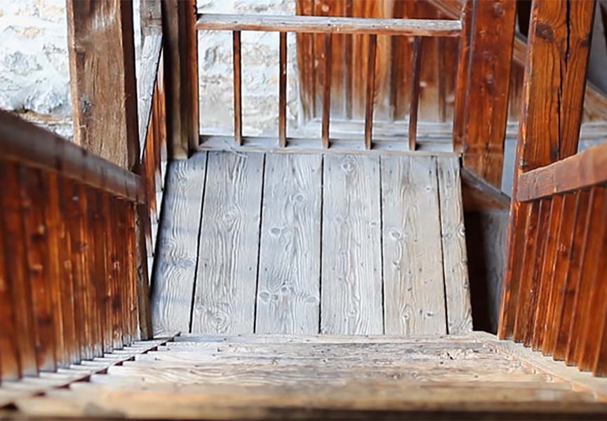 The wooden staircase is perfectly preserved