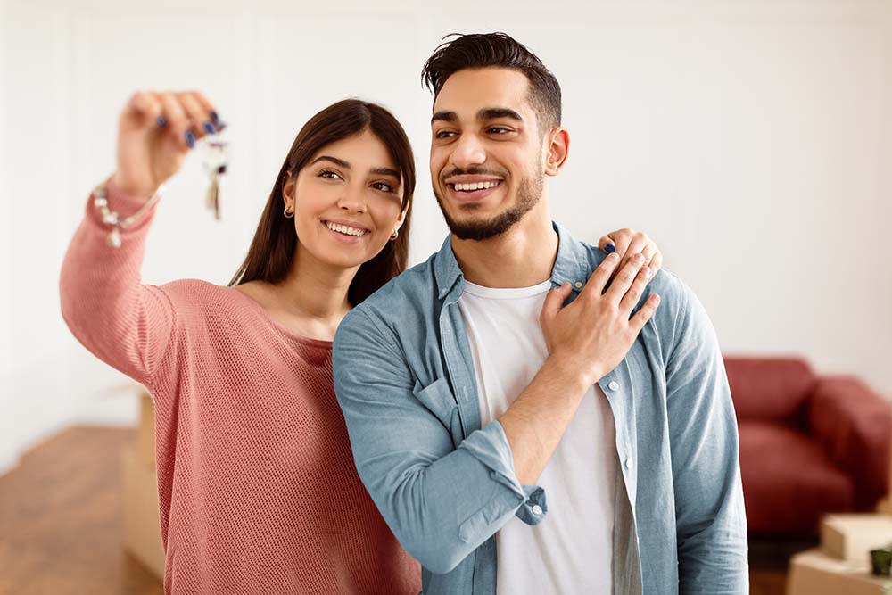 Celebrating completed secure property transaction Happy couple celebrating successful property transaction completion and secure registration process