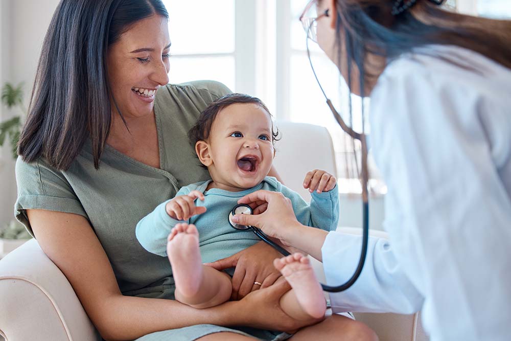 Irish citizens accessing medical services in Bulgaria with EHIC Irish mother with baby receiving professional medical consultation from Bulgarian healthcare provider using EHIC coverage for basic medical services