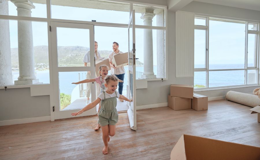 A family with children enters a new house with a sea view in Bulgaria, starting a new phase of life.